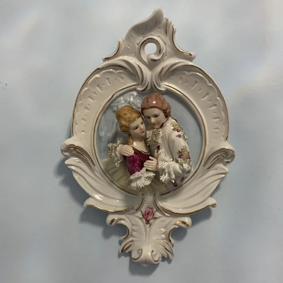 Porcelain mirror made in Italy 26”x 15”x4” plus 2 wall decorations 6”x9”
